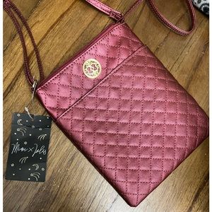 Cute Cranberry colored crossbody. Not expensive. Just a fun piece to have.